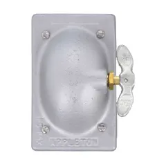 Malleable iron weatherproof cover for FS-series electrical boxes. Gray finish. Single-gang configuration with vertical mounting orientation. Overall height 4-9/16 inches. Compatible with toggle flush switches. Suitable for outdoor or damp locations where protection of switches is required.