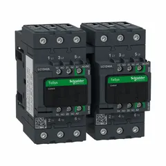 Reversing IEC contactor with 3 poles and 3 normally open contacts rated at 40 A. Coil voltage is 48 V AC at 60 Hz; no integrated surge suppression. Used to control forward and reverse rotation of three-phase motors in applications such as conveyors, pumps, and hoists.