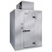 This KOLPAK self-contained compressor walk-in cooler provides 940 cubic feet of refrigerated storage. It features a ceiling-mounted evaporator and includes a floor section. The unit uses R-454c refrigerant and has a height of 100 1/4 inches. Typical applications include commercial cold storage for perishable goods in food service and retail environments