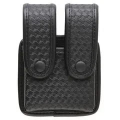 Black nylon magazine pouch designed for duty use. Measures 2 inches by 6 inches and fits belts up to 2 1/4 inches wide. Securely carries spare magazines for quick access.