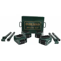 This machine roller kit includes four rollers, each 4 in long by 2 1/2 in wide, with a rubber-padded top plate and a black finish. The deck height is 3 15/16 in. Two handles are included for maneuvering. Used for moving heavy machinery and equipment across flat surfaces in industrial maintenance and rigging applications.
