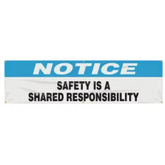 Poly sheeting banner printed on one side with the message 'Safety Is A Shared Responsibility.' Suitable for indoor and outdoor use. Nominal size 28 in x 96 in. No wind slits.