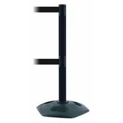 This retractable belt post barrier features a black plastic post and rubber base, with a 7 1/2 ft black belt that has no pattern or legend. It is used to manage pedestrian flow and cordon off areas in industrial facilities, warehouses, and public spaces.