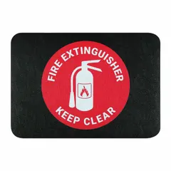 This polypropylene safety mat measures 24 inches by 17 inches with a 1/8-inch thickness and features an adhesive backing for secure placement. It is designed to mark the area in front of a fire extinguisher, helping to keep the zone clear and accessible in industrial, warehouse, and commercial settings.