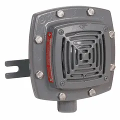 Horn alarm for hazardous locations, rated for indoor/outdoor use. Operates on 24V DC. Measures 7 5/8 in length by 7 3/8 in width. Gray finish.