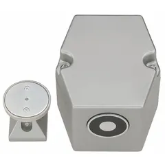 Floor-mounted electromagnetic door holder constructed of aluminum. Fail Safe failure mode releases the door to close automatically upon power loss or fire alarm activation. Suitable for holding fire-rated doors open in commercial buildings.