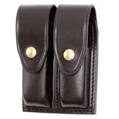 This duty equipment pouch is constructed from black leather with a basket weave finish and features a snap closure. Designed to carry magazines, it is suitable for use by security and tactical personnel requiring secure ammunition storage.