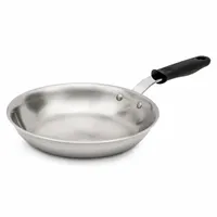This uncoated fry pan features a silver stainless steel body with a black silicone riveted handle. It is NSF certified for commercial foodservice use. Suitable for searing, sautéing, and pan-frying in high-heat kitchens