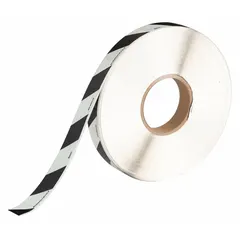 This glow-in-the-dark floor marking tape features a black/white striped pattern for high visibility in normal light and photoluminescent glow for low-light conditions. Made of 9.4 mil thick polyester with no message legend, it is commonly used to mark pathways, exits, and hazards in industrial or commercial settings.