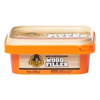 This natural-colored wood filler is supplied in an 8 oz tub and is designed for filling gaps, cracks, and imperfections in wood surfaces. Its stainable formula accepts most wood stains for color matching, making it suitable for interior wood repairs such as furniture, trim, and cabinetry