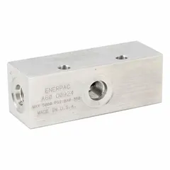 Aluminum valve manifold with SAE O-Ring Boss port connections. Overall height 1.25 in, overall length 3.5 in. Used in hydraulic systems to distribute fluid flow between pumps, valves, and actuators in applications such as pressing, lifting, and clamping.