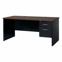 This single pedestal desk features a walnut melamine laminate desktop with a particleboard core, supported by a black steel frame. It includes one pedestal with two drawers and a modesty panel. Suitable for general office or workstation use