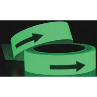 Green glow-in-the-dark vinyl floor marking tape with arrow pattern, 1 1/4 in wide by 50 ft long, 19 mil thickness. No message legend. Used to mark pathways, exits, or hazards in low-light industrial environments; absorbs ambient light and remains visible during power outages