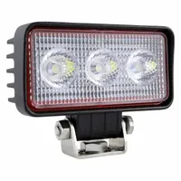 This GROTE LED floodlight provides wide-area illumination for vehicle lighting applications. It features a black housing, bracket mount, and blunt cut wires for electrical connection. Suitable for use on off-road, construction, agricultural, and industrial equipment