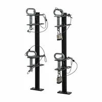 This trailer frame-mount tool holder secures two trimmers for transport. The channel-style design provides organized storage, and the locking mechanism deters theft. Suitable for landscaping equipment storage on trailers