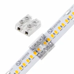 This terminal block connector is used for tape-to-tape or tape-to-terminal-block connections in linear LED lighting systems. It accepts wire gauges from 20 AWG to 16 AWG and measures 0.62 inches in length. Suitable for low-voltage connections in architectural, commercial, and residential installations.
