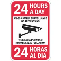 Aluminum sign with mounting holes for wall attachment. Nominal size 18 in x 12 in, no header, not glow-in-the-dark. Bilingual text warns of 24-hour video surveillance and no trespassing. Suitable for posting in industrial facilities, warehouses, or restricted areas to deter unauthorized entry