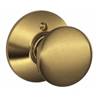 The SCHLAGE F170 PLY 609 is a dummy knob lockset in the Plymouth style, finished in brass. It is designed for non-latching applications such as double doors or cabinet pulls, providing a coordinated appearance without a locking function
