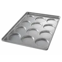 This 12-slot bun pan is constructed from aluminized steel for even heat distribution. With an overall depth of 1 1/2 inches, it is suited for baking hamburger buns, muffin tops, and cookies in commercial kitchens and foodservice operations