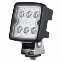 LED floodlight with a black hardshell housing and hardshell electrical connection. Overall width 3 15/16 inches. ECE compliant. Suitable for wide-area illumination on vehicles, trailers, and off-road equipment for work-site lighting and safety applications