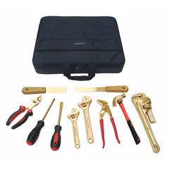 This nonsparking tool set includes 10 pieces: tongue and groove pliers, slotted screwdriver, two adjustable wrenches, and a hammer, all stored in a tool case. Designed for use in hazardous environments where flammable gases, vapors, or combustible dusts are present, such as oil refineries, chemical plants, grain silos, and mining operations.