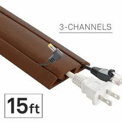 This flexible rubber cable floor cover manages and protects cables on walkways, reducing trip hazards. It features 3 channels for organizing multiple cords. Overall width is 2 5/8 inches, overall height is 5/8 inch, and length is 15 feet. Color is brown.