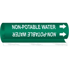 Green wrap-around pipe marker with white legend reading 'Non-Potable Water'. Fits pipe O.D. from 1/2 to 1-3/8 in. Includes directional arrows. Used to identify pipes carrying non-potable water in industrial, water treatment, and HVAC systems.