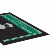 This 3 ft x 5 ft polypropylene entrance mat with adhesive backing marks the location of an emergency eye wash station. The 1/8 in thick mat is designed for placement at facility entrances or near safety equipment to guide personnel during emergencies