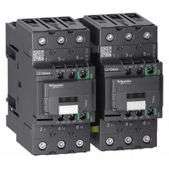 Reversing IEC contactor with 3 poles and 3 normally open contacts, rated at 65 A with a 24V DC coil. No integrated surge suppression. Used for forward/reverse control of three-phase motors in applications such as conveyors, hoists, and pumps.