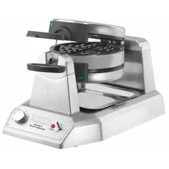This double waffle maker features two 7-inch non-stick cooking plates, allowing simultaneous production of two waffles. Designed for continuous use in commercial foodservice settings such as hotels, cafeterias, and diners, it operates on 120V AC. The non-stick surfaces facilitate easy release and cleaning.