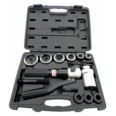 This knockout punch tool kit creates holes in steel panels and enclosures. The set includes six hydraulic punch dies, three adaptors, two power screws, a drill bit, and a carrying case. Punch range is 1/2 in to 2 in. Typical applications include electrical, HVAC, and industrial maintenance for conduit, cable, or pipe entry points.