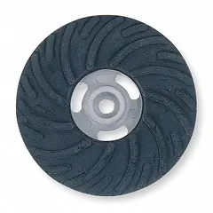 This NORTON backing pad is a medium-density, air-cooled fiber disc support pad with a 5/8"-11 threaded hole for tool connection. It is used to support fiber discs during grinding and finishing operations, providing a balance of flexibility and support for blending, deburring, and surface preparation.