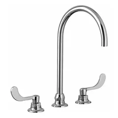 This widespread handle bathroom faucet from the Monterrey series features a chrome finish and is constructed of brass. It includes blue and red color indexes for hot and cold identification. Suitable for residential or commercial sink installations.