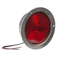 Red round incandescent stop light with 5 1/2 in overall diameter. Permanent screw-mount installation. Blunt cut wires for electrical connection. Complies with FMVSS 108 standards. Used on heavy trucks, trailers, and commercial vehicles for brake and turn signaling