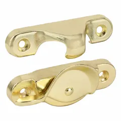 This non-handed window sash lock is designed for single-hung windows. It mounts on the sash and includes a handle for operation. The lock features a brass-plated gold finish and has an overall length of 1-15/16 inches. Suitable for residential window applications where a sweep lock is required.