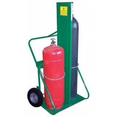Side-by-side hand truck for transporting two gas cylinders. Green finish, chain securing mechanism, 24 in W x 13 in D nose plate. 400 lb capacity. Used in industrial welding environments for moving compressed gas cylinders.