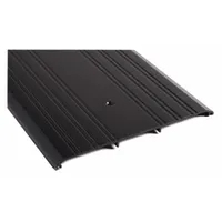 Aluminum saddle threshold, 4 ft long, with fluted transition type. Used to bridge gaps under doors, sealing against drafts, moisture, and debris in commercial or industrial doorways