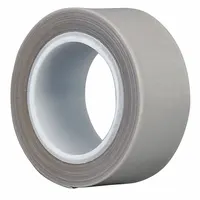 This PTFE slick surface tape consists of a silicone-coated polytetrafluoroethylene film in gray. It is 1/2 inch wide, 5 yards long, and 6.5 mils thick. The tape provides a low-friction, non-stick surface for chutes, guides, conveyor beds, and other industrial equipment where material buildup or adhesion is a concern