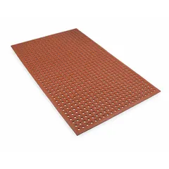 This oil and grease-resistant drainage mat is made of red natural rubber with a raised-bones pattern and beveled edge. It is 5/8 in thick, reversible, and measures 3 ft x 5 ft. Commonly used in industrial workstations, assembly lines, and machine shops to reduce operator fatigue and provide slip resistance in wet or oily environments.