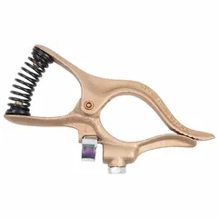 Spring-loaded ground clamp rated for 300 A, accepting 3/0 AWG cable. Copper construction provides high conductivity. Used in welding applications to establish a secure electrical connection to the workpiece.