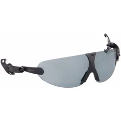 Anti-fog and scratch-resistant eye shield assembly designed for mounting on hard hats and helmets. Features a gray lens and gray frame with suspension mounting. Suitable for use in industrial environments requiring impact protection and glare reduction.