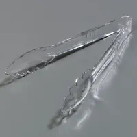 These CARLISLE serving tongs are constructed entirely of clear plastic, with both blades and handles made from the same material. They are NSF Certified and dishwasher safe, making them suitable for food-service environments where sanitation compliance is required. The tongs are used for portioning and serving food in commercial settings such as cafeterias and restaurants