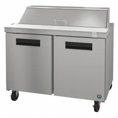This HOSHIZAKI refrigerated prep table offers 12 cu ft of storage with two doors, a height of 44 1/4 in, and a depth of 31 in. It features thermostatic control for temperature management. Suitable for commercial food preparation areas requiring chilled ingredient storage and a work surface.