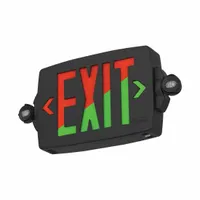 Black plastic exit sign with two faces, green/red LED illumination, and universal field-selectable chevrons. Operates on 120-277V AC with nickel cadmium battery backup and self-diagnostics. Suitable for ceiling or wall mounting in commercial and industrial facilities requiring code-compliant emergency egress marking