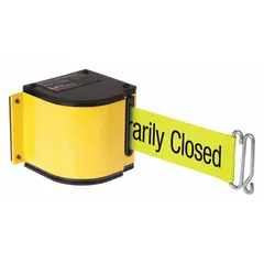 Rack-mount retractable belt barrier with 18 ft yellow belt and yellow frame. Black message color. Used for pedestrian traffic management and area separation in warehouses, distribution centers, and industrial facilities.