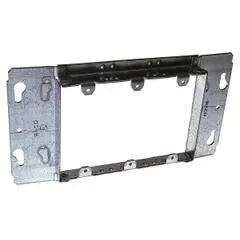 Steel blank plaster ring for electrical boxes. Raised height of 3/4 in, overall dimensions 8.88 x 4.5 in. Used to cover boxes in wall or ceiling installations, providing a flush or raised mounting surface or sealing the box when no device is required.