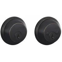 Standard cylindrical deadbolt with conventional core cylinder and core included. Features a C keyway and Aged Bronze finish. Designed for maximum door thickness of 1 3/8 in. Suitable for securing doors in commercial or residential applications
