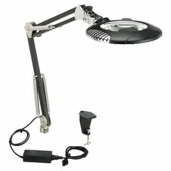 This LED magnifier light provides 2x magnification with a 4 diopter glass lens, delivering up to 750 lumens at 5000K color temperature. The 43-inch aluminum arm offers flexible positioning, and the unit operates on 100 to 240V AC. ESD-safe construction protects sensitive components during inspection and assembly tasks.
