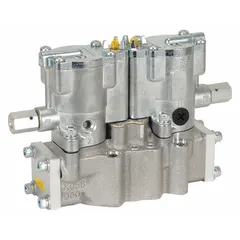 Four-way, two-position directional control valve with double solenoid actuation and plug-in design. Features female 1 in NPT ports, internal pilot operation, solenoid return, and locking manual override. Used in industrial pneumatic systems to control compressed air flow to actuators and cylinders.