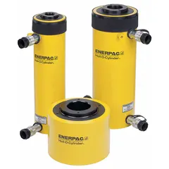 ENERPAC RRH1003 general purpose hollow ram with 100 ton nominal capacity, 3 in nominal stroke length, and 3.13 in type dimension. The hollow plunger design allows rod pulling or cable tensioning through the center. Suitable for lifting, pressing, and tensioning applications in heavy industrial settings.